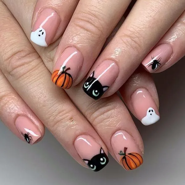 A close-up of nails painted with ghost designs
